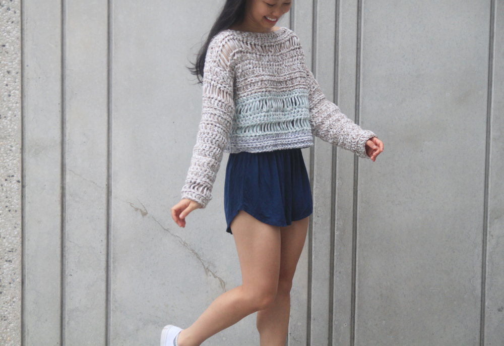 cropped summer crochet sweater with mesh details and blue shorts