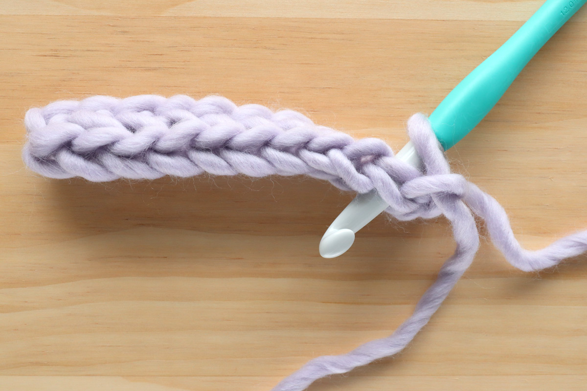 working crochet hook from back to front herringbone stitch