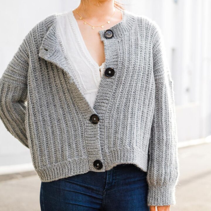 oversized gray crochet cardigan with knit look ribbing and large black buttons