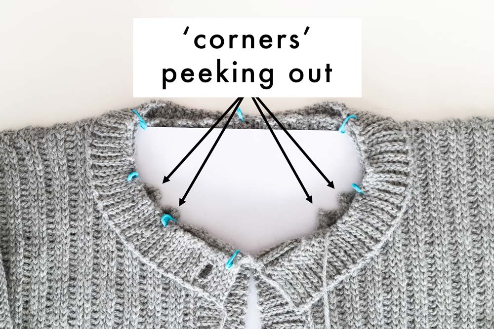 corners of front panels increase and decreases peeking out behind the neckline ribbing