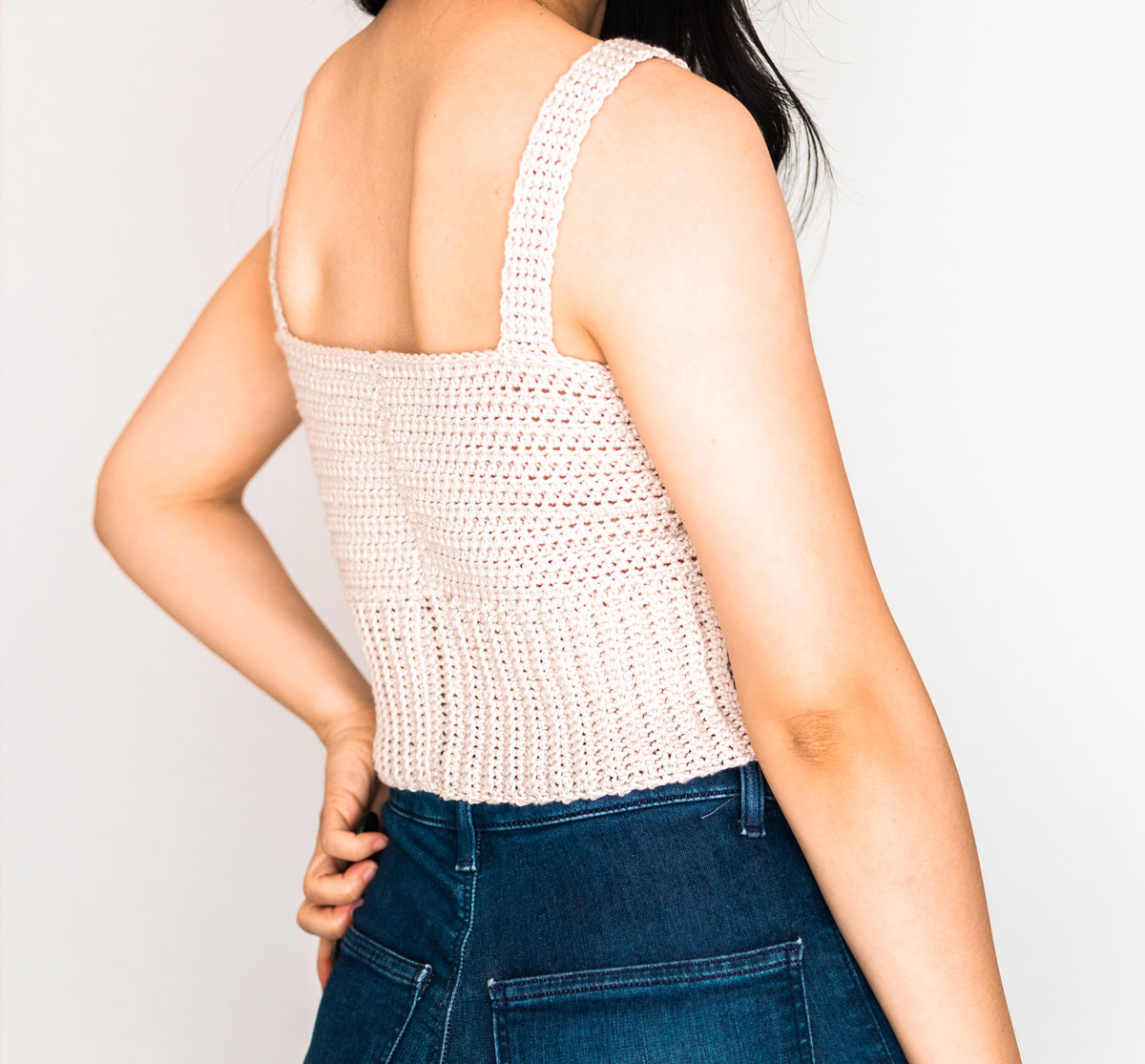 back view of cropped crochet top with ribbed waist