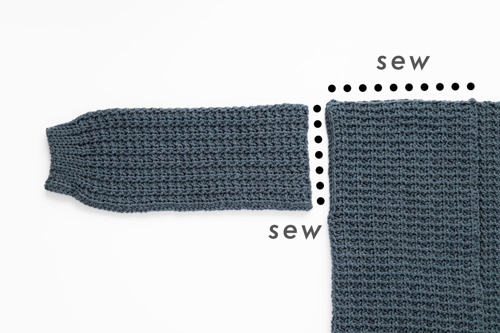 crochet sleeve sewn to body panels on midnight waffle cardigan
